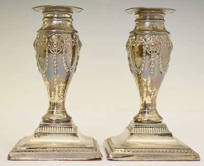 Lot 227 - Pair of George V silver low candlesticks with neo-classical decoration