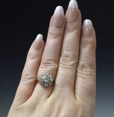 Lot 7 - Early 20th century diamond yellow and white metal flower head cluster ring