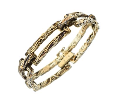 Lot 88 - 9ct yellow and white gold open panel bracelet