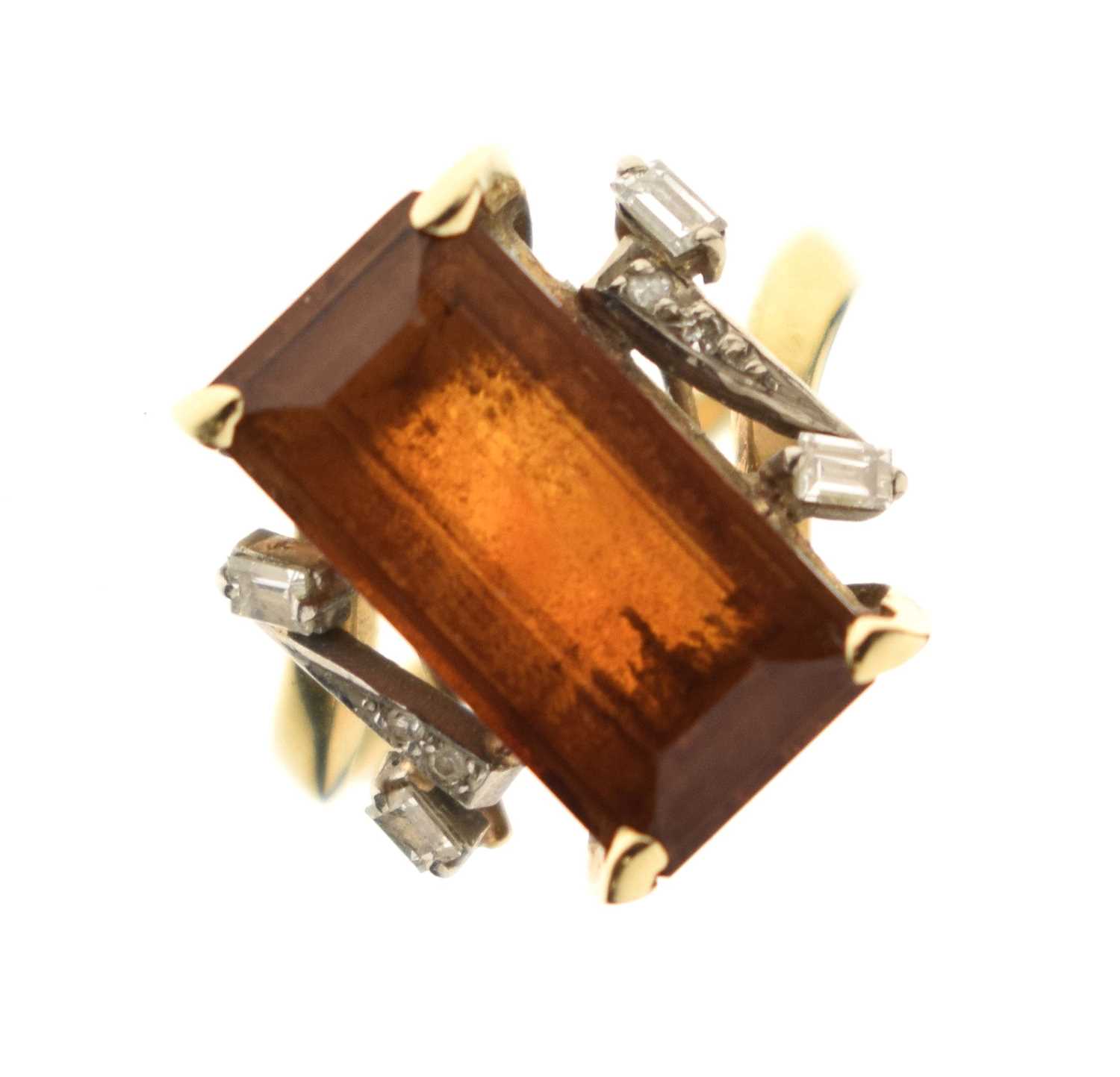 Lot 23 - Brown citrine and diamond yellow and white metal ring