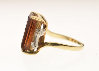 Lot 23 - Brown citrine and diamond yellow and white metal ring
