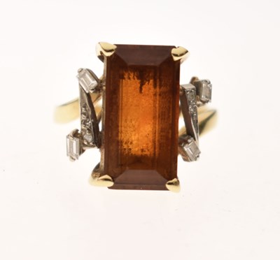 Lot 23 - Brown citrine and diamond yellow and white metal ring