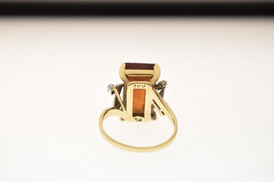 Lot 23 - Brown citrine and diamond yellow and white metal ring