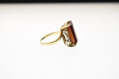 Lot 23 - Brown citrine and diamond yellow and white metal ring