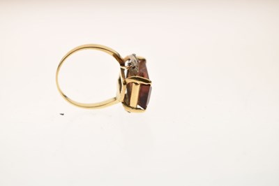 Lot 23 - Brown citrine and diamond yellow and white metal ring