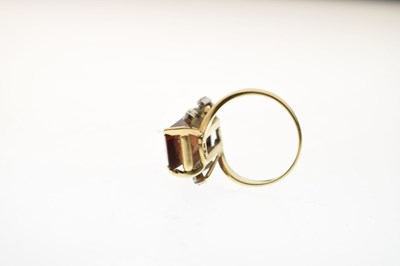 Lot 23 - Brown citrine and diamond yellow and white metal ring