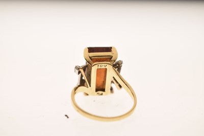 Lot 23 - Brown citrine and diamond yellow and white metal ring