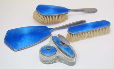 Lot 222 - George V silver and blue guilloche enamel part dressing set