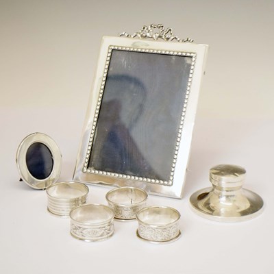 Lot 224 - Four silver napkin rings, ink pot, and two photo frames