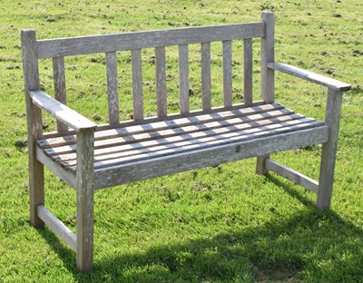Lot 824 - Teak two-seater garden bench of slatted design