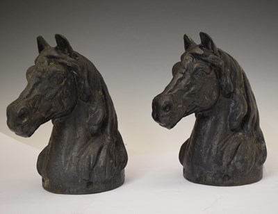 Lot 375 - Pair of black painted cast iron horse heads