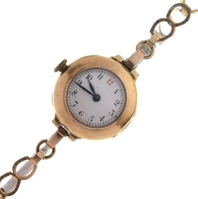 Lot 185 - Lady's 18K gold cased bracelet watch