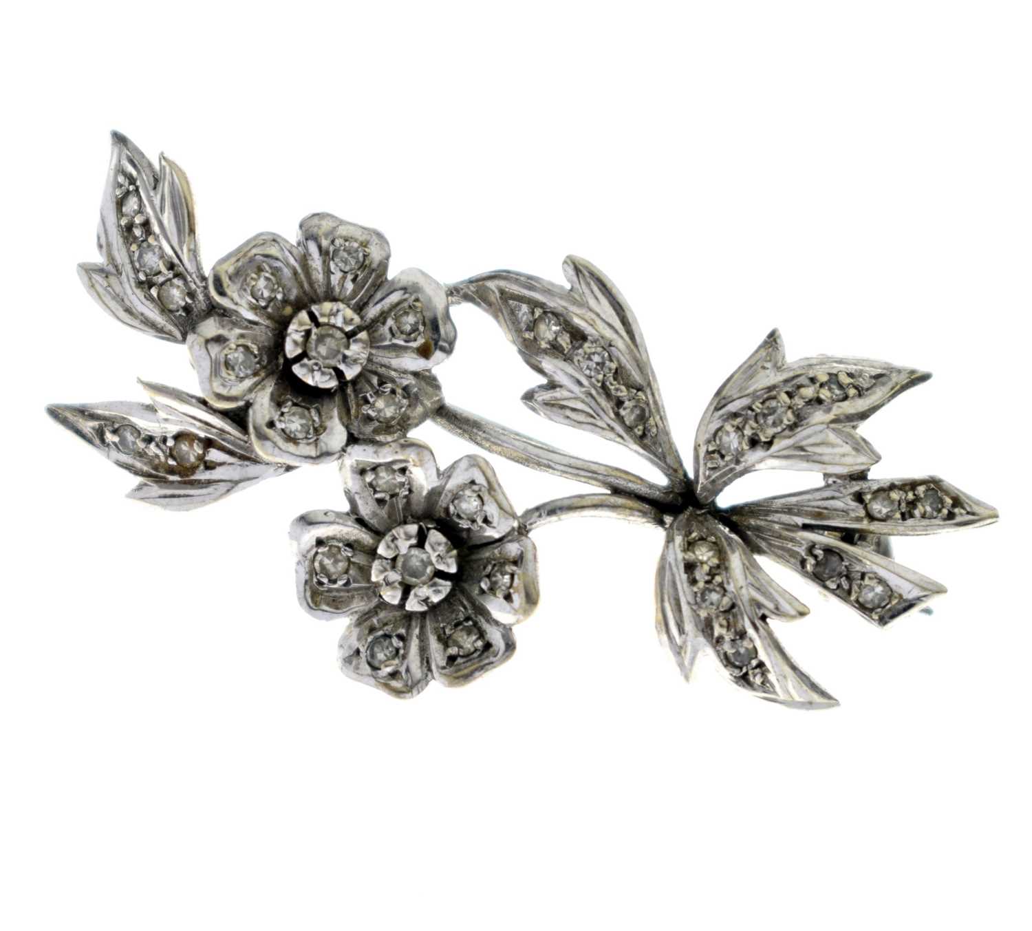 Lot 35 - Diamond unmarked white metal floral spray brooch