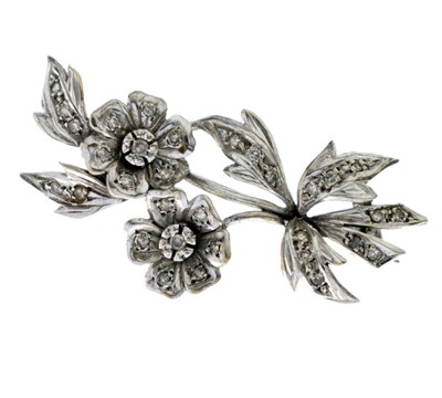 Lot 35 - Diamond unmarked white metal floral spray brooch