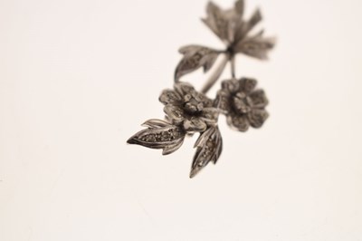 Lot 35 - Diamond unmarked white metal floral spray brooch