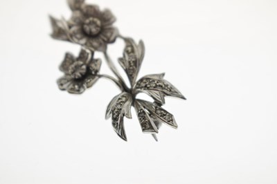 Lot 35 - Diamond unmarked white metal floral spray brooch