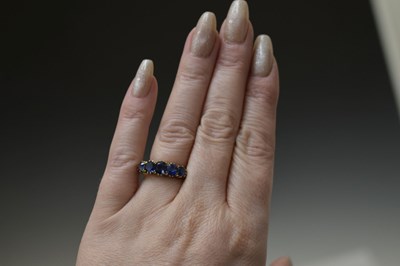 Lot 11 - Late 19th century sapphire five stone unmarked yellow metal ring