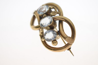 Lot 53 - 19th century topaz yellow metal knot brooch