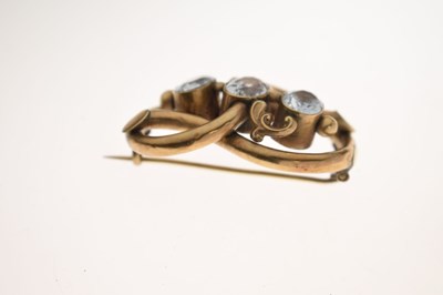 Lot 53 - 19th century topaz yellow metal knot brooch