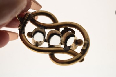 Lot 53 - 19th century topaz yellow metal knot brooch