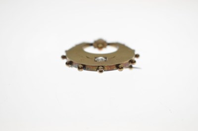 Lot 40 - 19th century diamond and coral unmarked yellow metal crescent brooch
