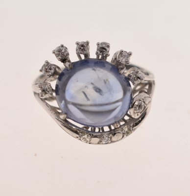 Lot 27 - Sapphire and diamond 14K white metal ring