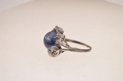 Lot 27 - Sapphire and diamond 14K white metal ring