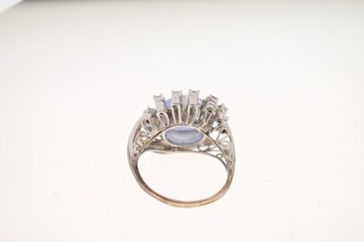 Lot 27 - Sapphire and diamond 14K white metal ring
