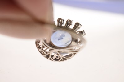 Lot 27 - Sapphire and diamond 14K white metal ring