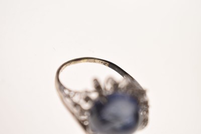 Lot 27 - Sapphire and diamond 14K white metal ring