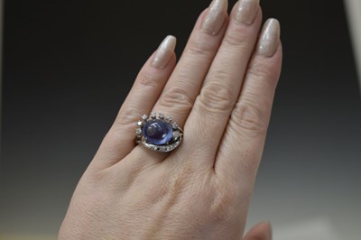 Lot 27 - Sapphire and diamond 14K white metal ring