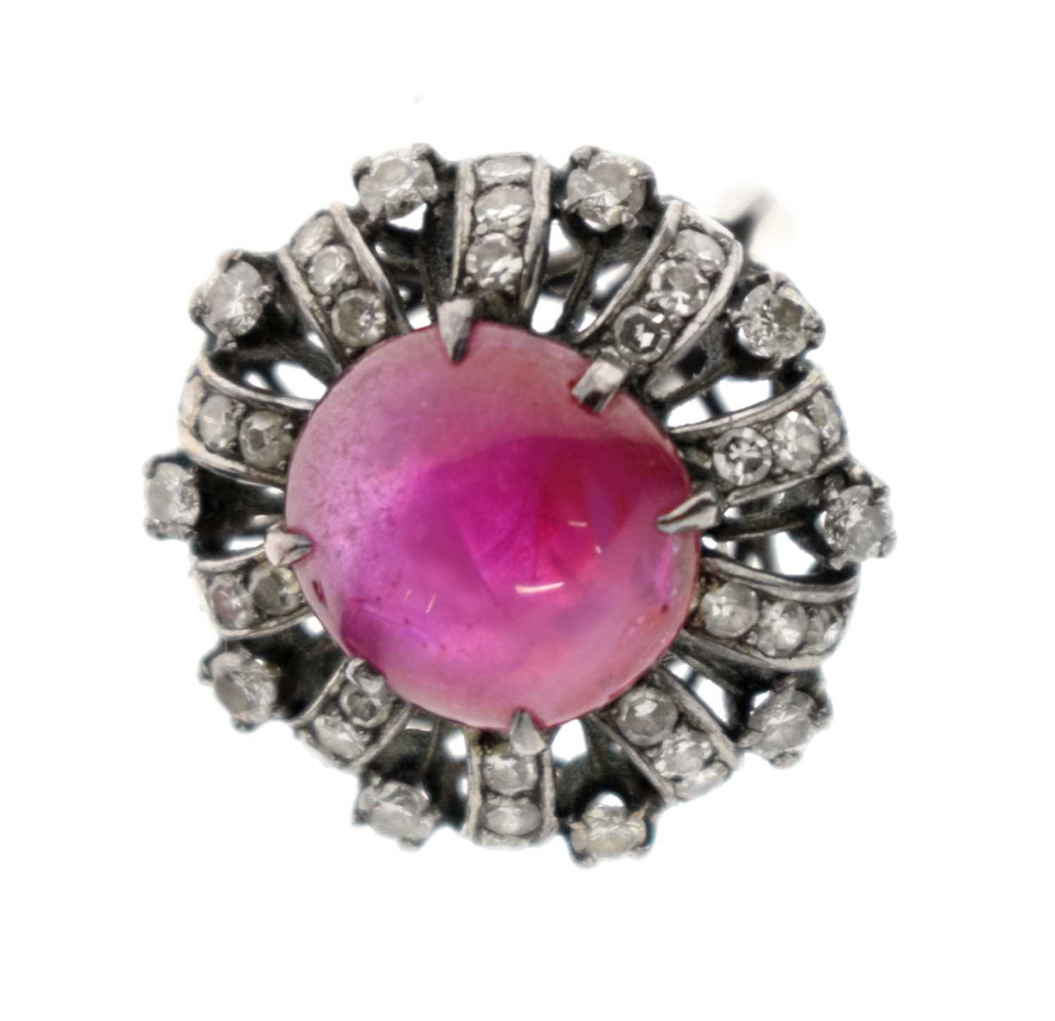 Lot 18 - Ruby and diamond unmarked white metal cluster ring