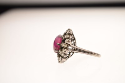 Lot 18 - Ruby and diamond unmarked white metal cluster ring