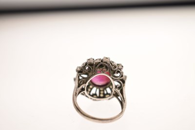 Lot 18 - Ruby and diamond unmarked white metal cluster ring