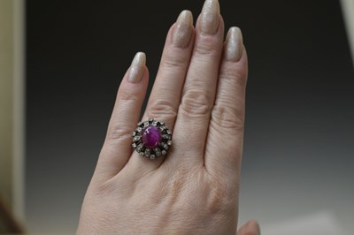Lot 18 - Ruby and diamond unmarked white metal cluster ring