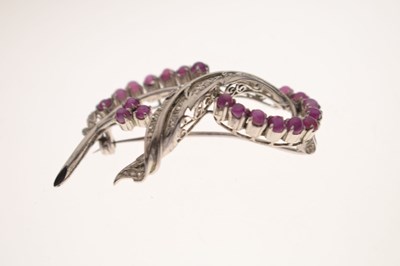 Lot 19 - Ruby and diamond 18k white metal spray brooch