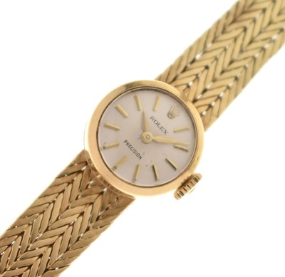 Lot 137 - Rolex - Lady's 'Precision' 18k gold integrated bracelet watch