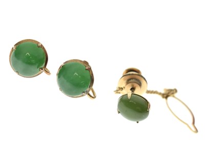 Lot 130 - Pair of jade cabochon yellow metal earrings, plus a tie pin