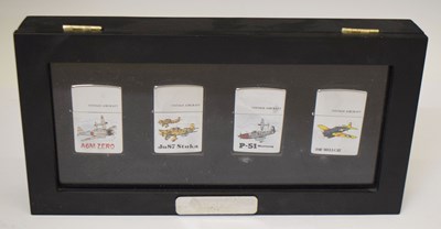 Lot 391 - Set of four Zippo lighters, each decorated with vintage aircrafts