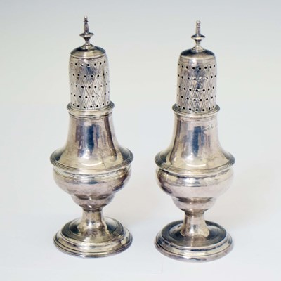 Lot 209 - Near pair of George III silver sugar casters
