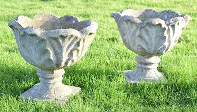 Lot 830 - Pair of composite stone low pedestal planters or urns