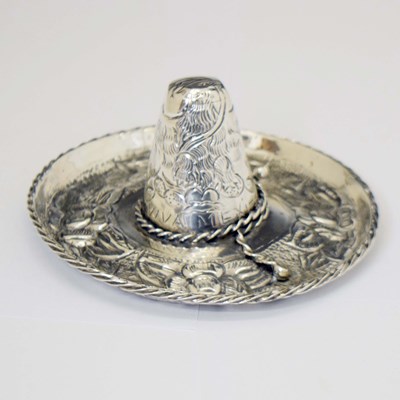 Lot 264 - Mexican white metal novelty ring holder in the form of a sombrero