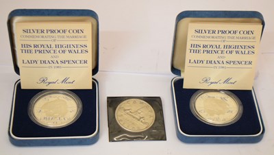 Lot 321 - Two Elizabeth II silver crowns and a Canadian dollar coin
