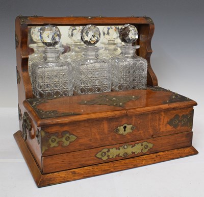 Lot 417 - Late Victorian oak three bottle tantalus box with mirror back