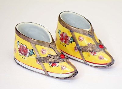 Lot 651 - Pair of Chinese porcelain and white metal model shoes