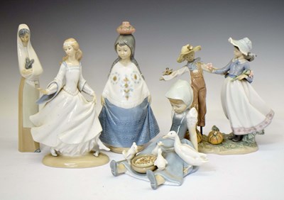 Lot 640 - Three Lladro figures and two Nao figures