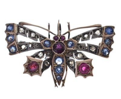 Lot 43 - Diamond, ruby and sapphire yellow and white metal pendant brooch in the form of a butterfly