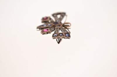 Lot 43 - Diamond, ruby and sapphire yellow and white metal pendant brooch in the form of a butterfly