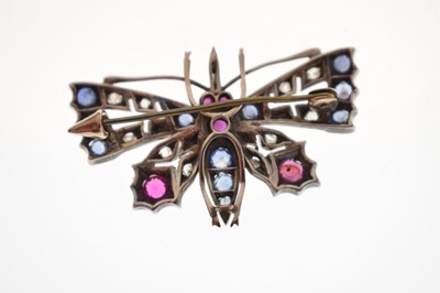 Lot 43 - Diamond, ruby and sapphire yellow and white metal pendant brooch in the form of a butterfly