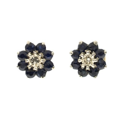 Lot 118 - Pair of 1970s sapphire and diamond cluster earrings